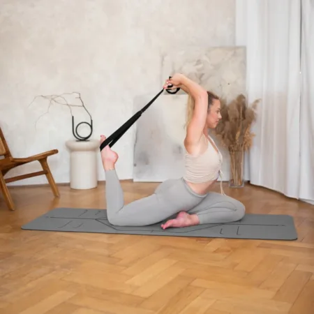 a woman stretching on a mat